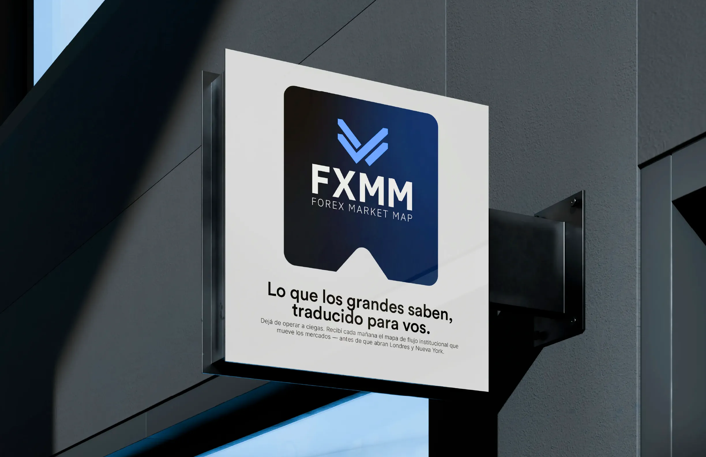 Hanging sign with the FXMM brand on a building front